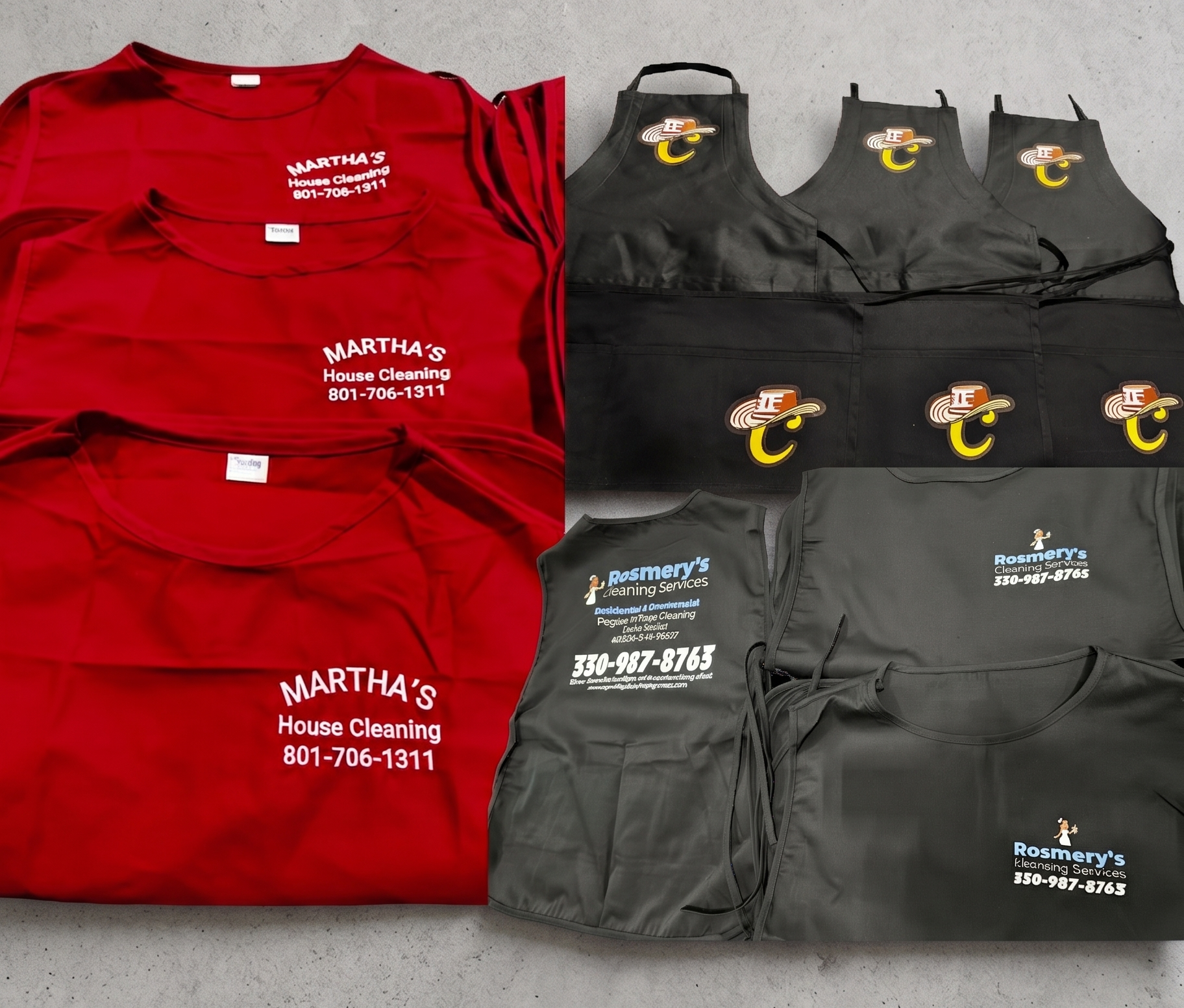 A collection of custom-printed red and black cleaning aprons arranged neatly against a clean, solid light-gray background.